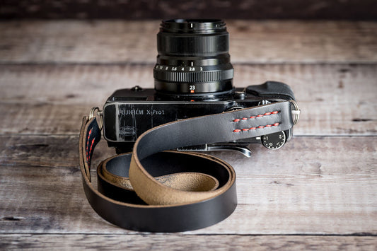 Handmade full-grain leather camera strap by 595strapco, showing natural patina and craftsmanship