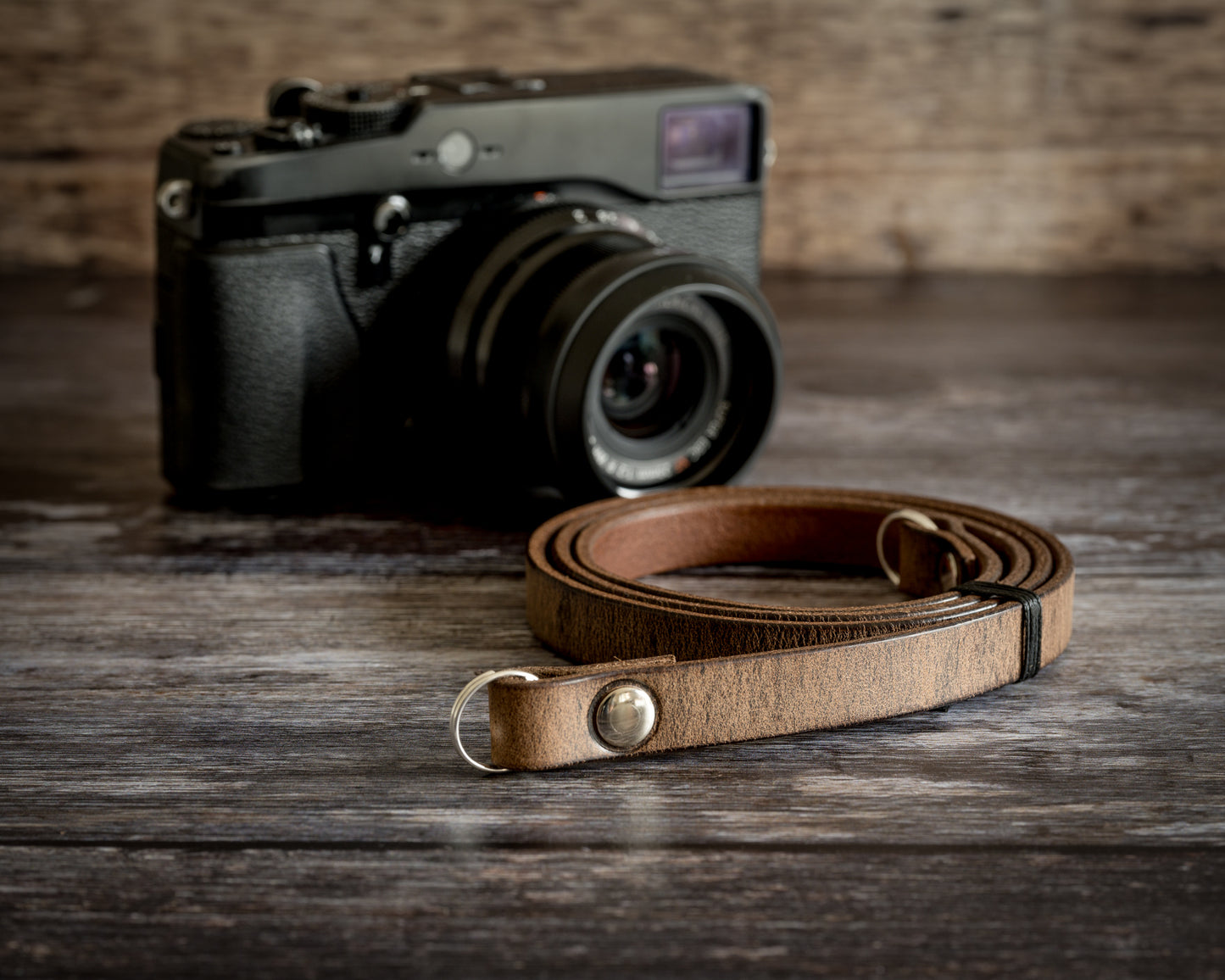 Premium hardware and fittings on antique brown leather camera strap