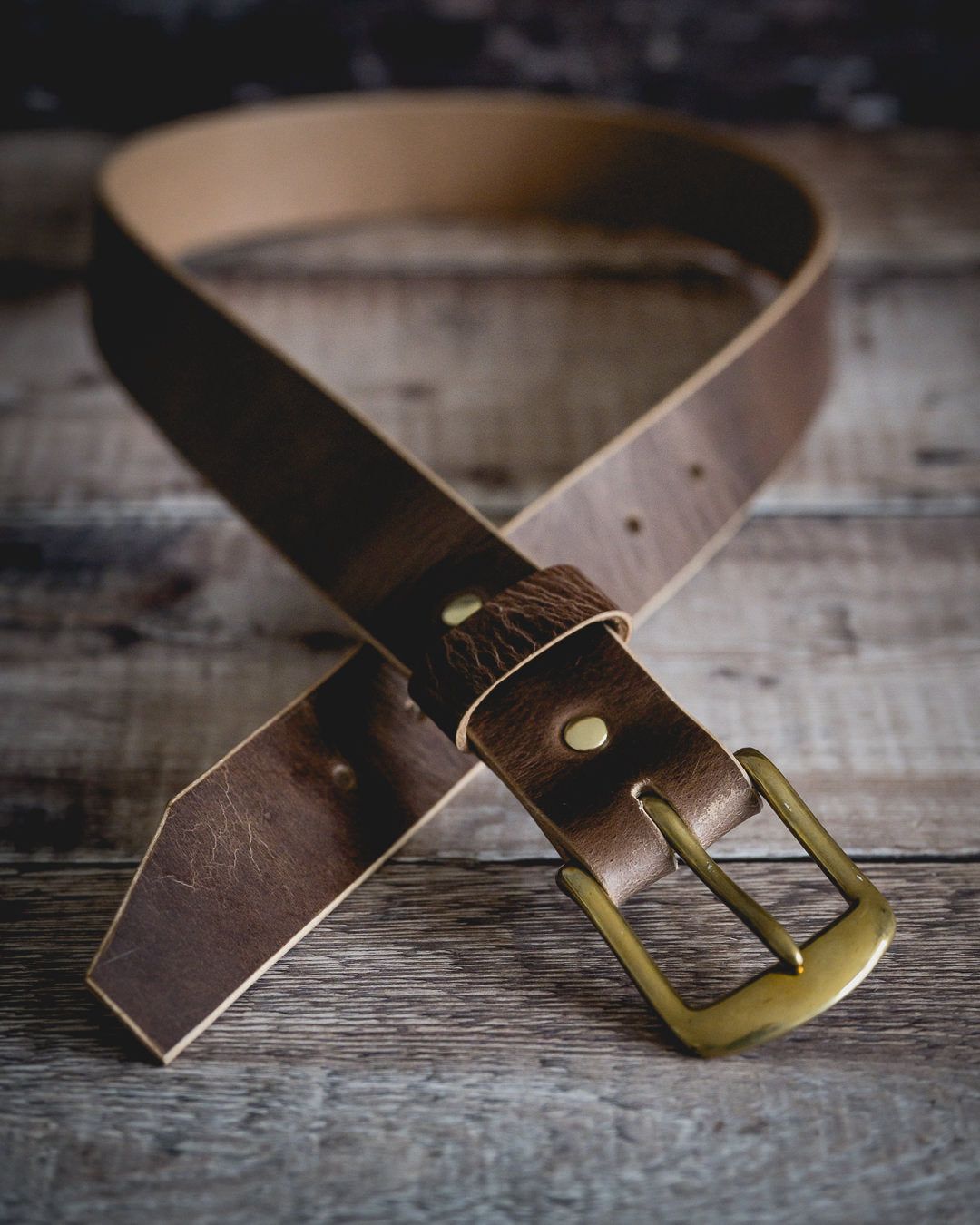 Beveled edges on handcrafted antique brown leather belt