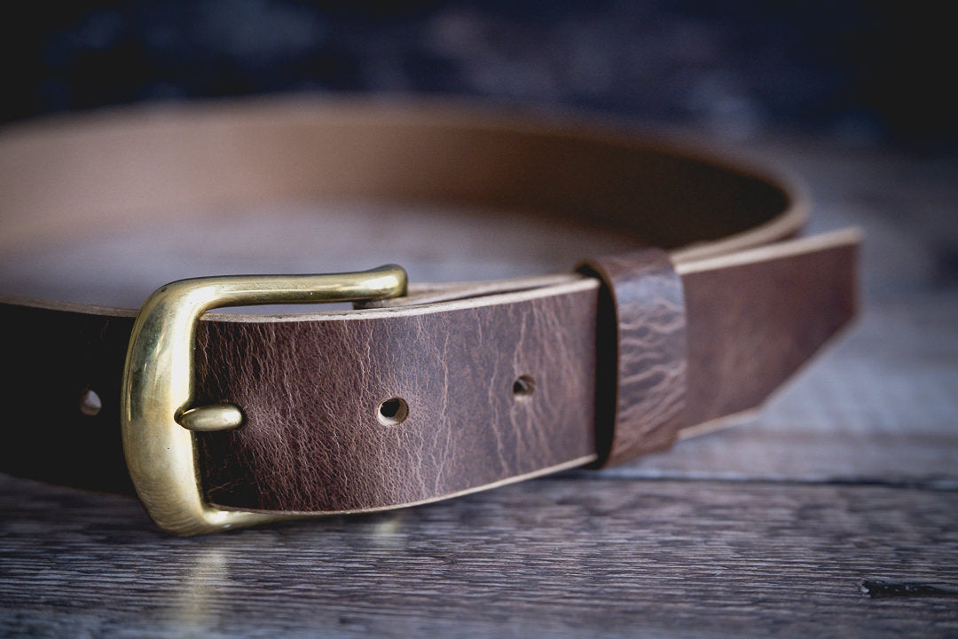 Antique brown veg tan leather belt showing natural patina development