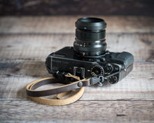 Load image into Gallery viewer, Quick release hardware detail on slim Horween leather camera strap