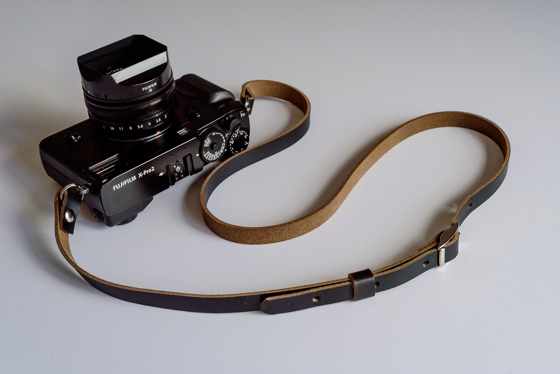 Close-up of adjustable length mechanism on Horween leather camera strap