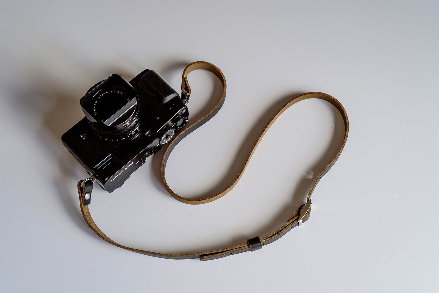Premium Horween Chromexcel leather grain detail on adjustable camera strap