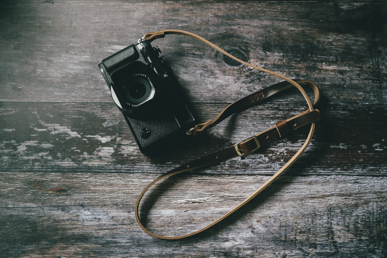 Premium nickel plate hardware on adjustable Horween leather camera strap