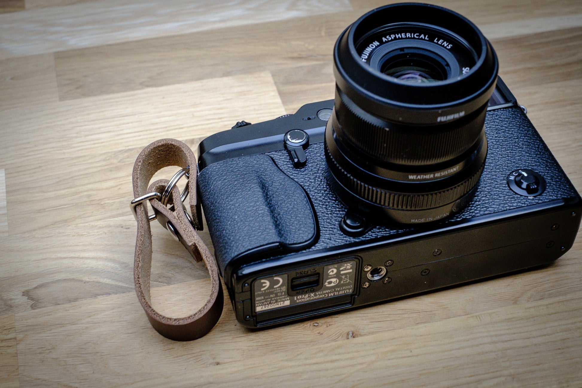 Leather finger strap for discreet camera grip handmade in UK
