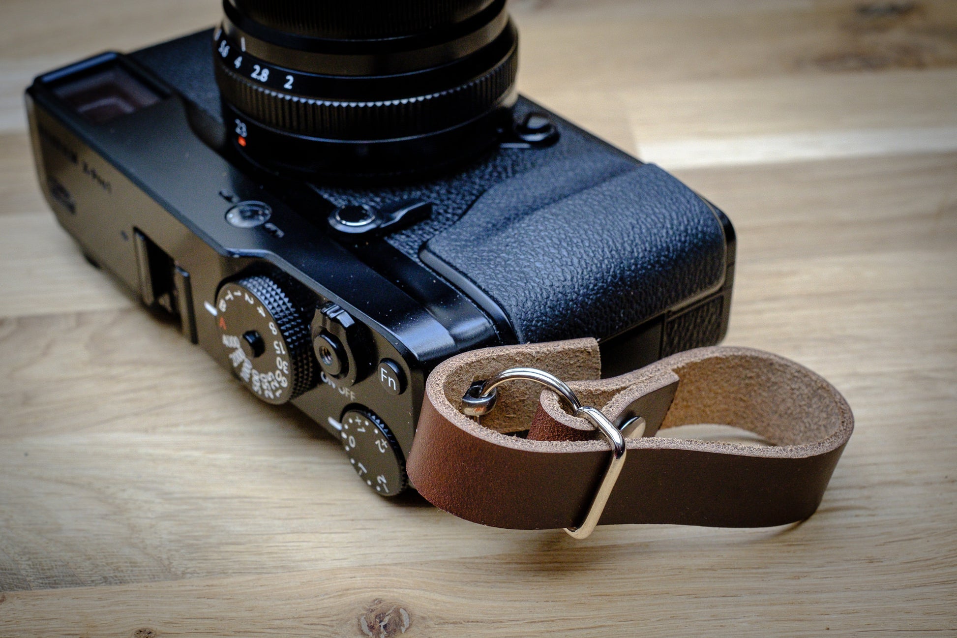 Close-up of adjustable 4 inch leather finger loop for camera grip