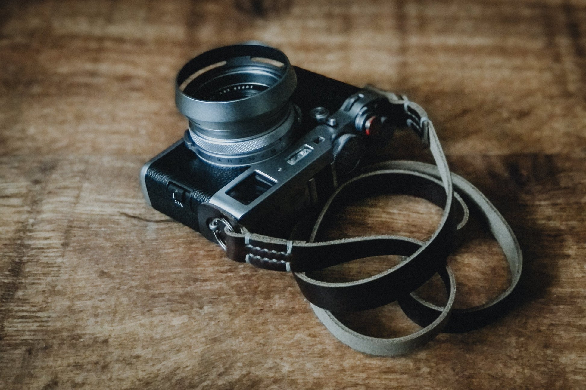 GRANADA minimal leather neck strap attached to camera showing slim 16mm profile