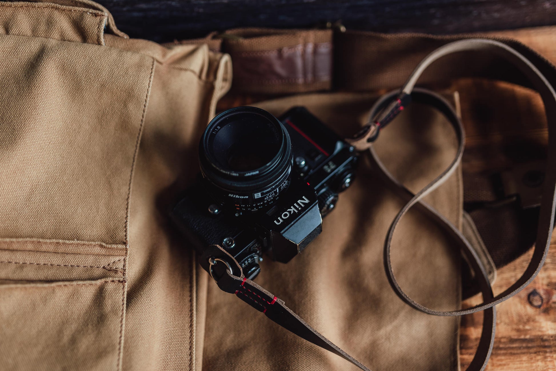 GRANADA leather strap showing hand-stitched thread color options black and red