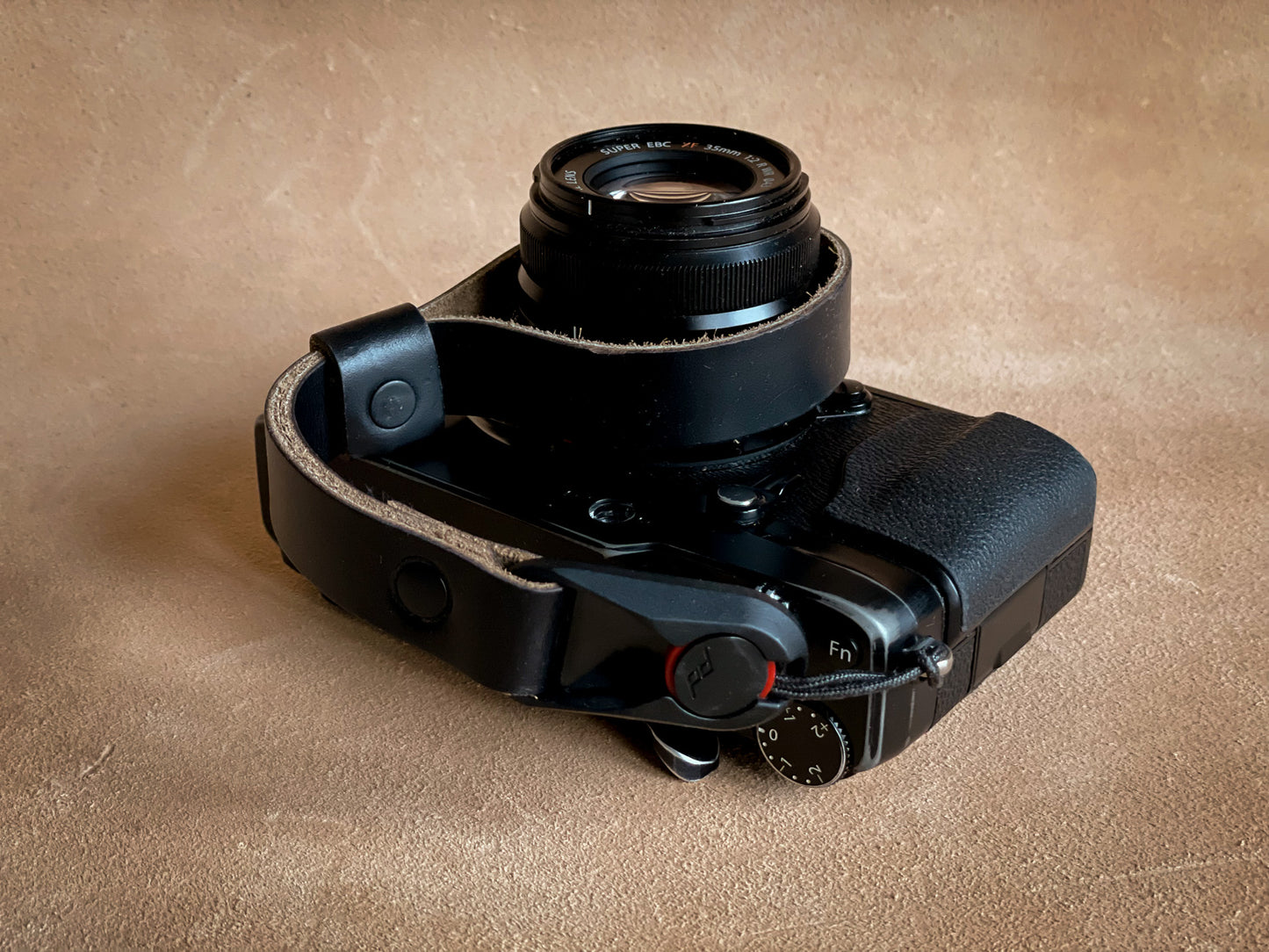 Quick release Horween leather wrist strap attached to camera