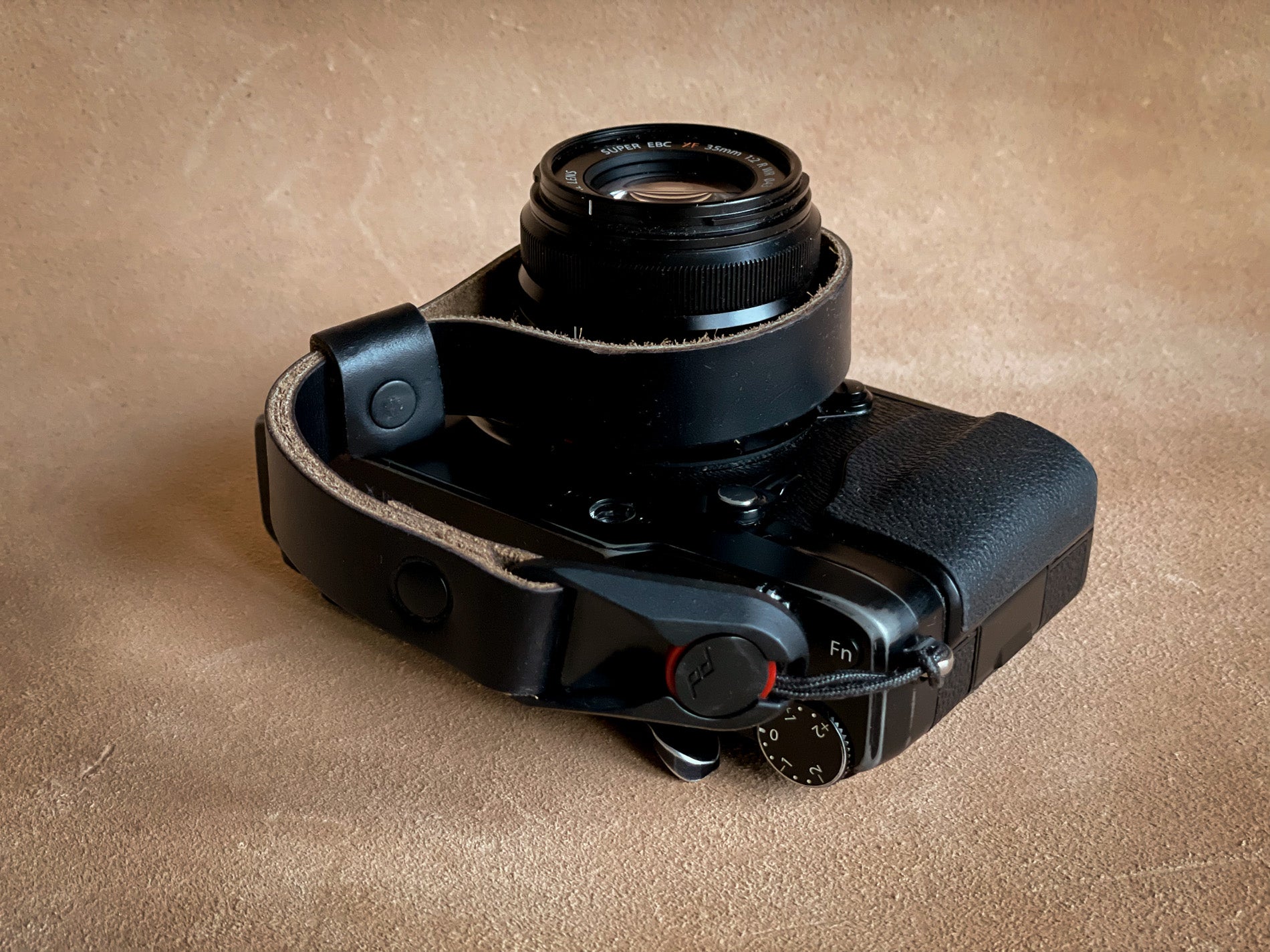 Quick release Horween leather wrist strap attached to camera
