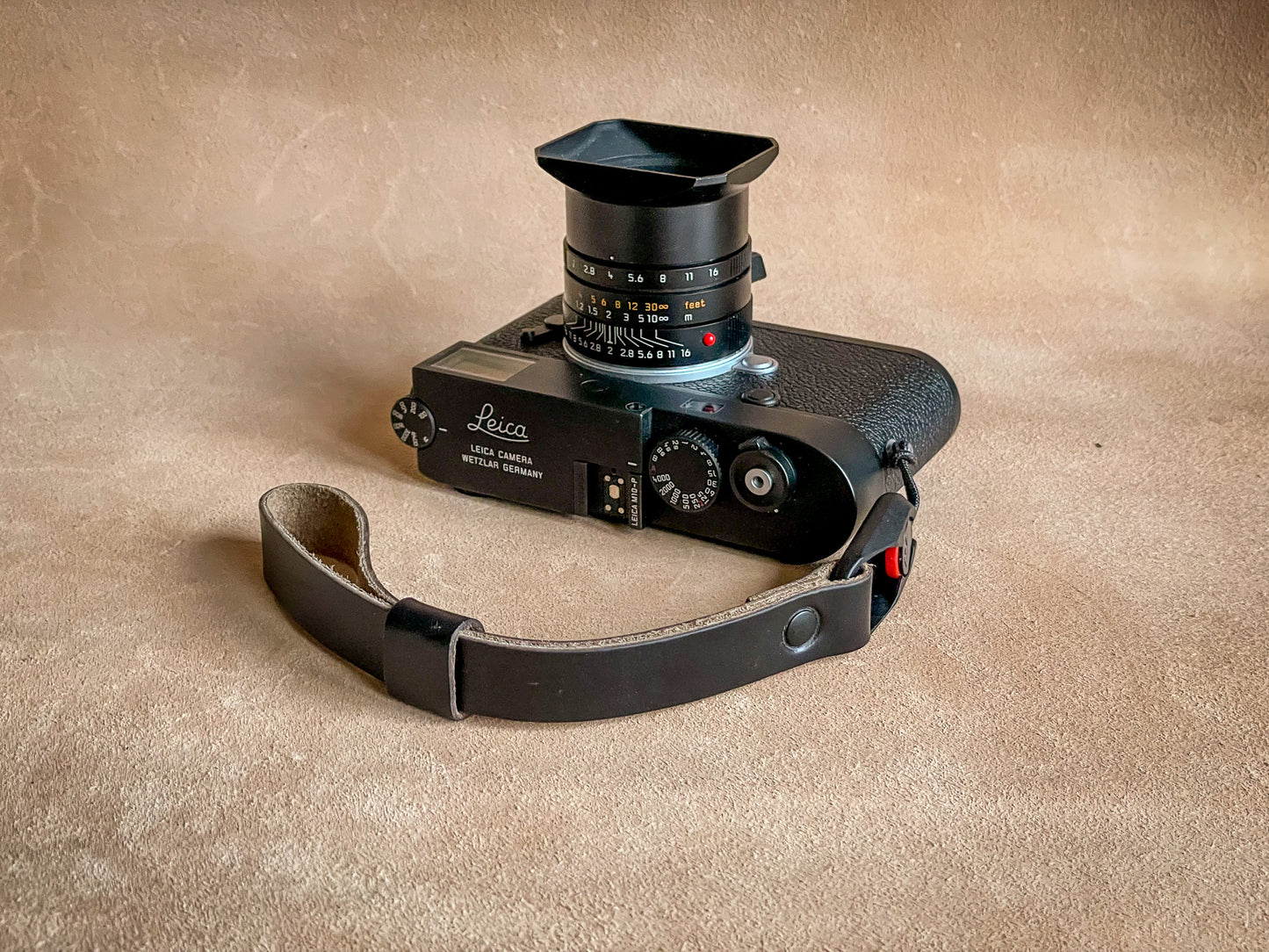 Handcrafted leather wrist strap with keeper and spare anchor link included
