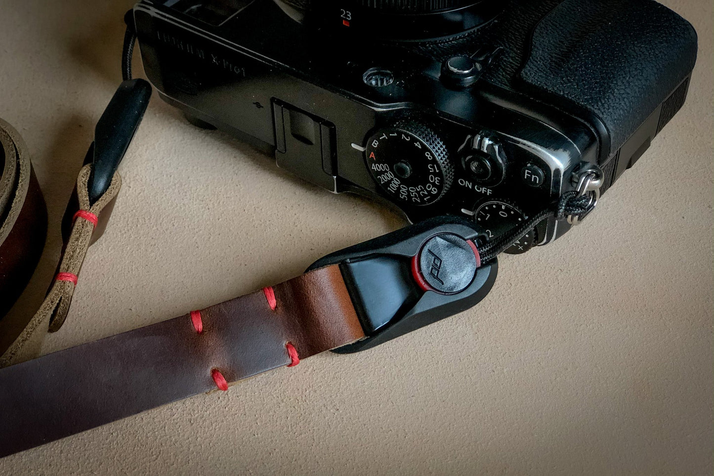 Quick release Horween leather anchor strap attached to camera