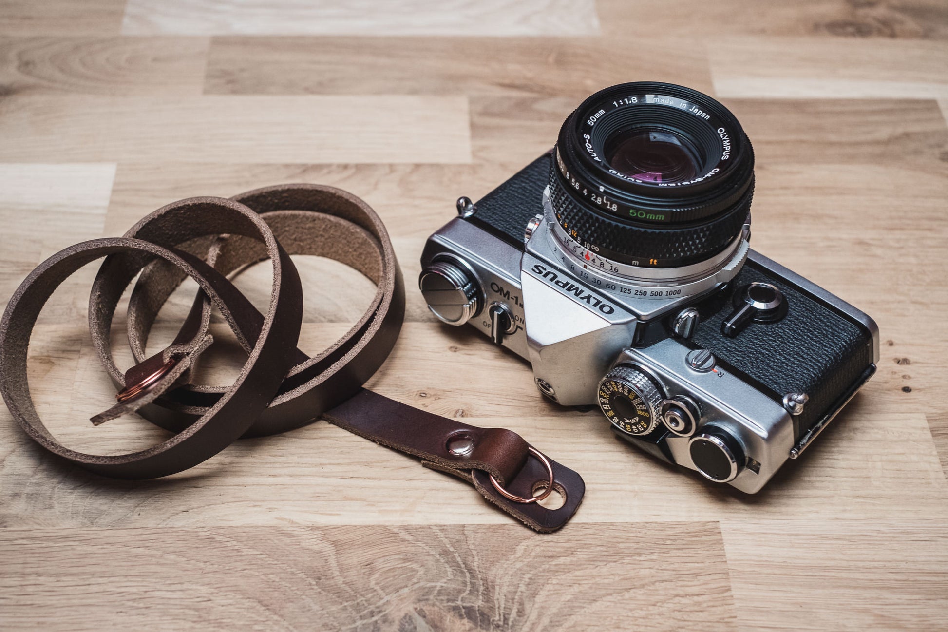 Close-up of integrated camera protection bumpers on VANTAGE Horween leather strap